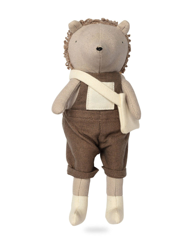 Harold The Hedgehog wears a brown overall with rolled cuffs and carries a small white bag. With light brown tones and textured hair, he's ready for secret garden adventures against a crisp white background.