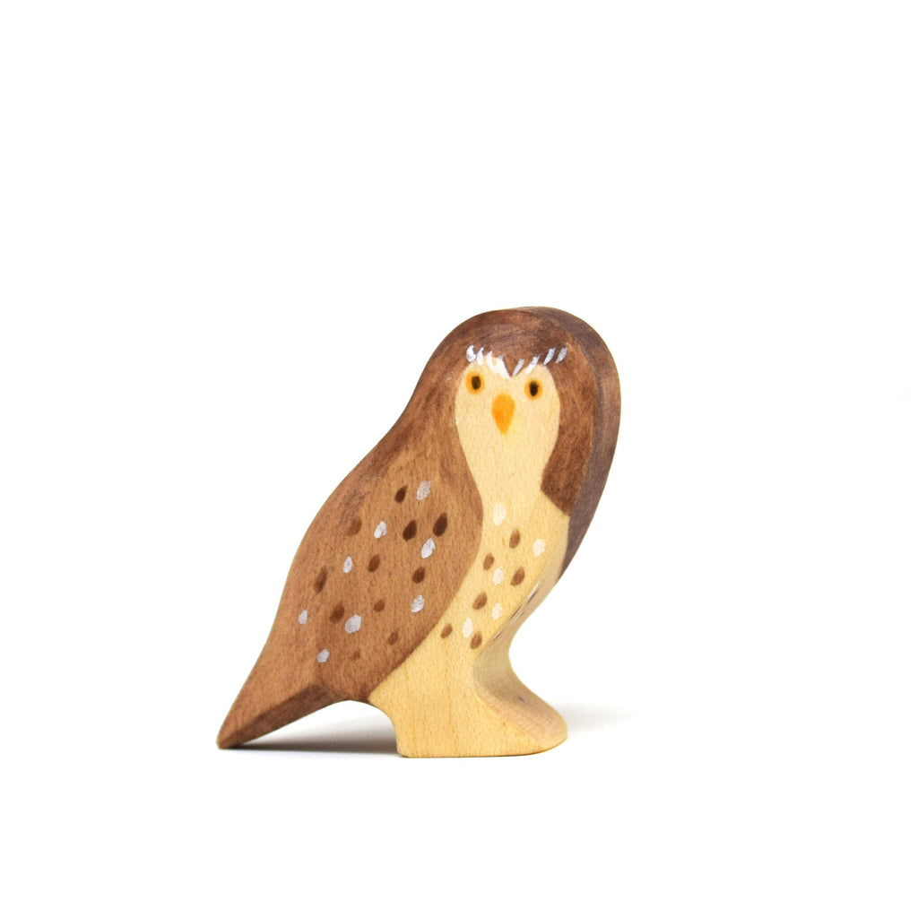 The Handmade Wooden Little Owl is a handcrafted figurine made from sustainable hardwood with brown, beige, and white details, finished in natural plant-based stains, displayed on a white background.