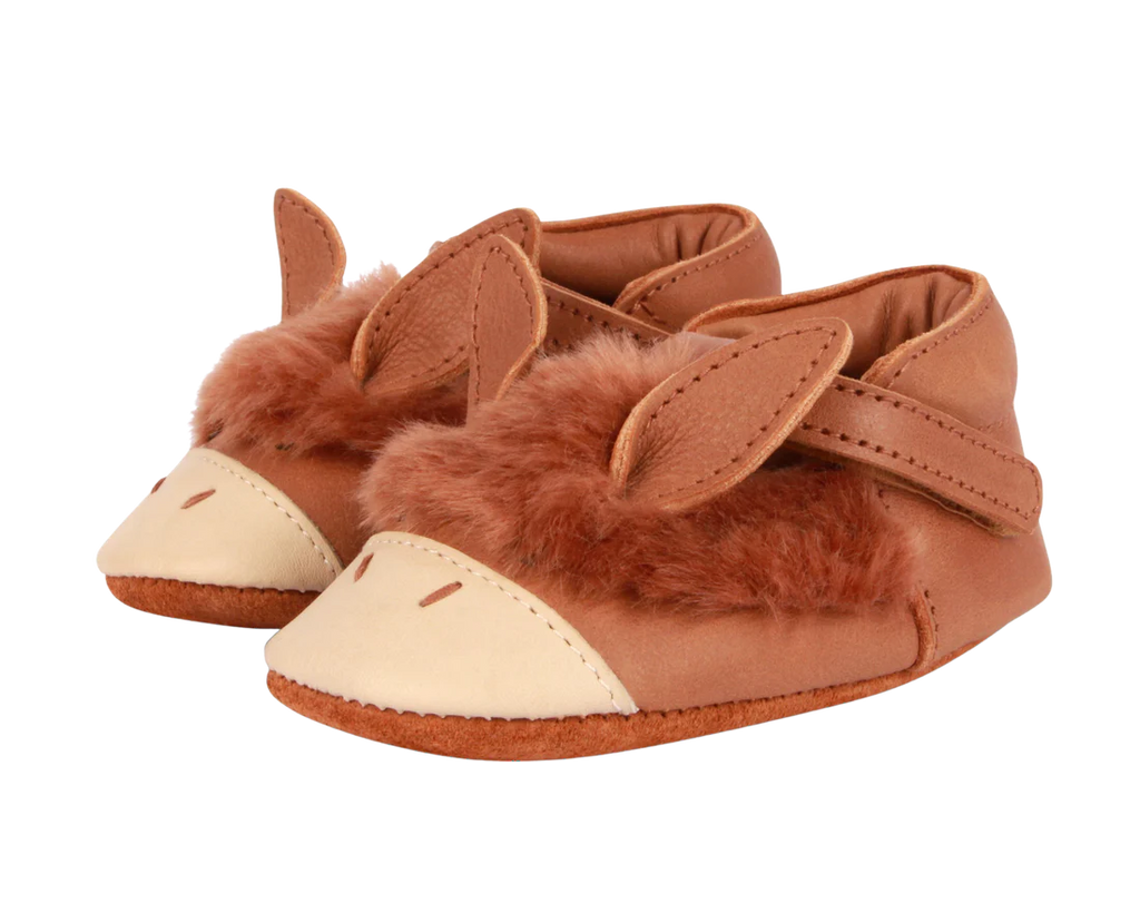 A pair of Donsje Baby Donkey Shoes designed to look like playful foxes, featuring soft brown fur and premium leather accents on the ears and snout, isolated on a white background.