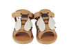 A pair of Donsje Baby Bee Shoes with brown premium leather straps and white decorative wings on the front, displayed against a white background.