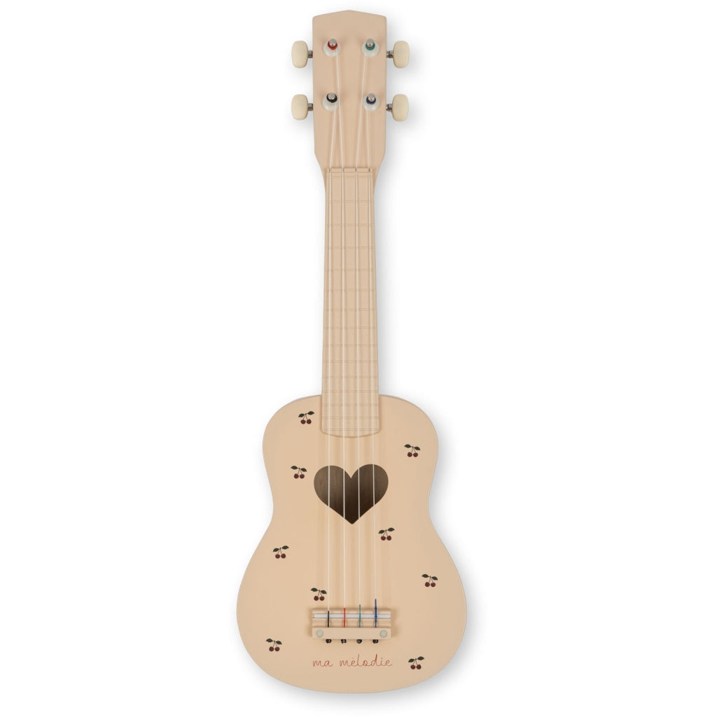 The Wooden Ukulele - Cherry is a small FSC-certified instrument with a heart-shaped sound hole, paw print decorations, white tuning pegs, and "ma mélodie" at the bottom—perfect for any music lover.