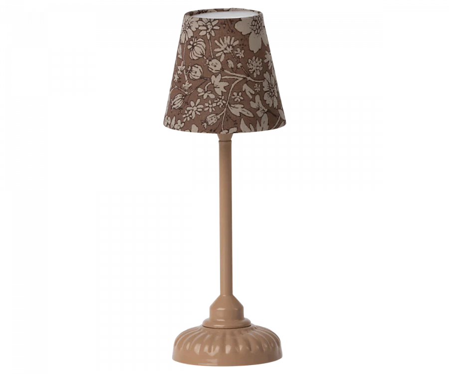 A Maileg Farmhouse - Fully Furnished with a farmhouse-style floral patterned lampshade and a curved, ornate base, presented on a simple background. The lamp is colored in shades of brown.