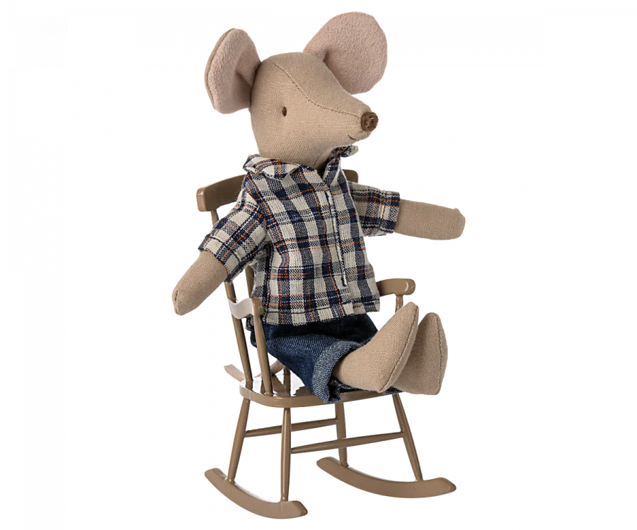 A Maileg Farmhouse - Fully Furnished stuffed toy mouse wearing a plaid shirt and denim pants, sitting on a miniature wooden rocking chair, isolated on a black background.