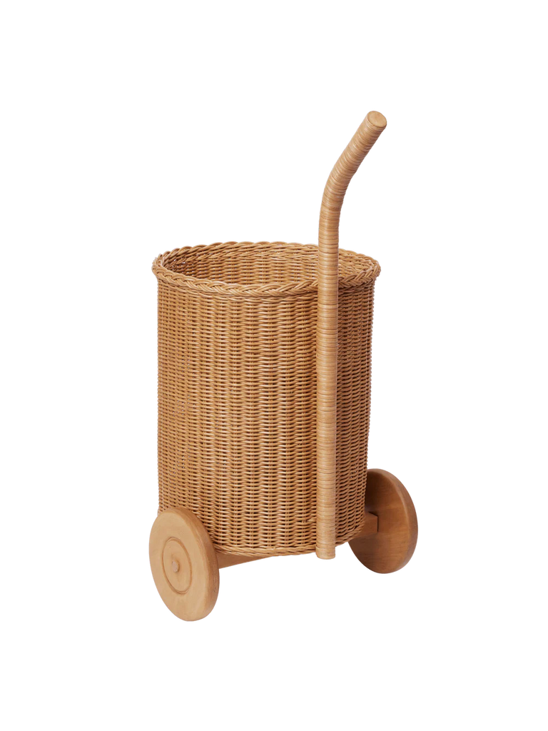 The Ferm Living Tukki Trolley - Natural features a tall curved handle and two large wooden wheels, serving as a stylish kids storage basket or toy storage, shown against a plain white background.