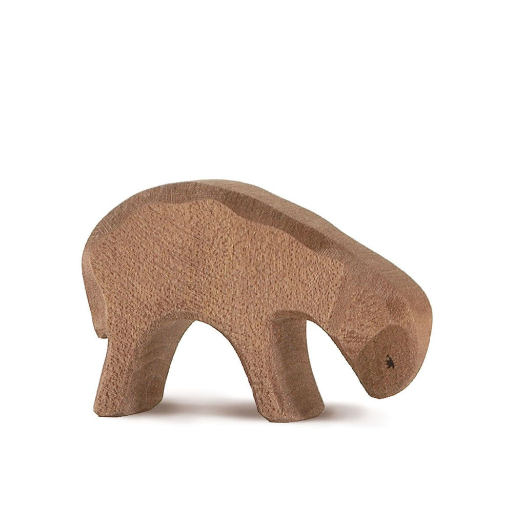 The Ostheimer Brown Sheep - Eating is a simple, handcrafted wooden toy with a smooth finish and minimal details, shown standing on four legs, ideal for imaginative play against a plain white background.