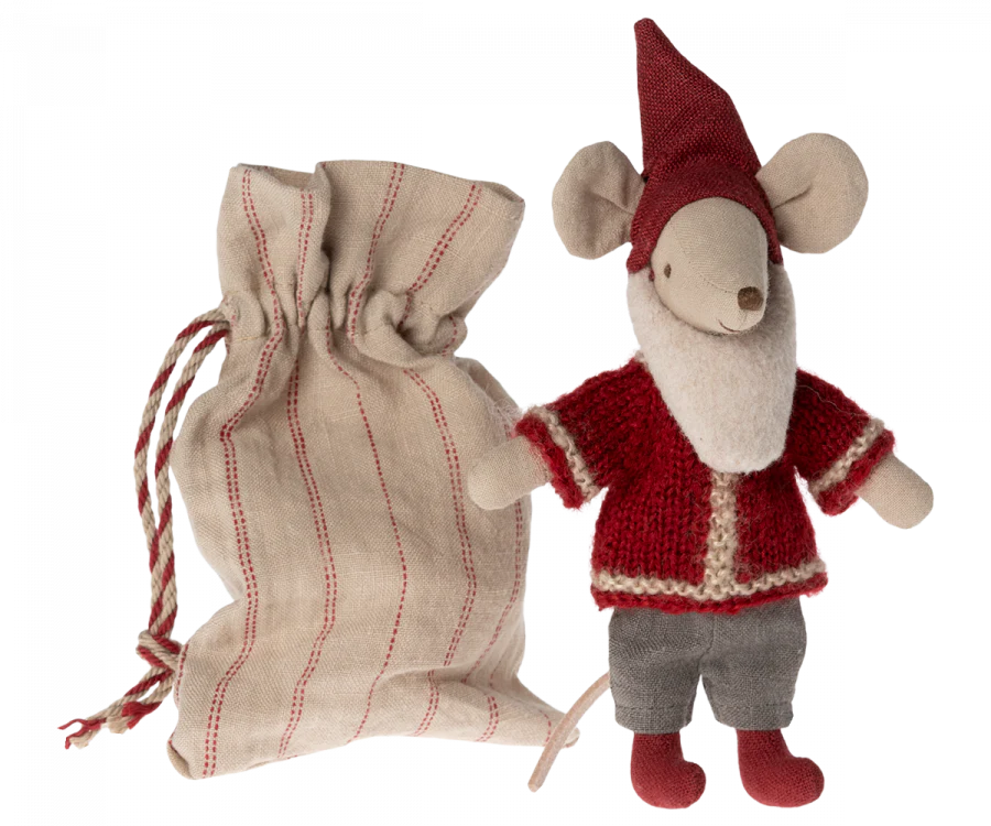 A Maileg Santa Mouse dressed in Santa clothes with a red knitted sweater, gray pants, and a red pointed hat stands next to a beige fabric drawstring bag with red stripes. The toy features large round ears and a long tail, perfect for Christmas night decorations.