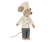 A Maileg Extra Clothing: Chef Clothes For Big Sister Mouse dressed as a chef, wearing a white chef's hat and jacket with houndstooth patterned pants, posing against a plain background.