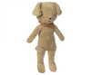 An old, well-loved Maileg plush dog with a worn-out beige fur and a vintage dog-striped orange and green bow tie, standing upright against a black background.