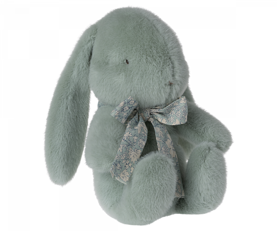 Maileg Small Plush Bunny in Mint with long floppy ears and a decorative floral bow around its neck, isolated on a black background.