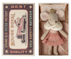 An antique matchbox labeled "Maileg Princess Little Sister, Mouse - Rose" next to a small, crafted mouse doll wearing a pink skirt and white collar, placed inside an open matchbox lined with pink bed linen.