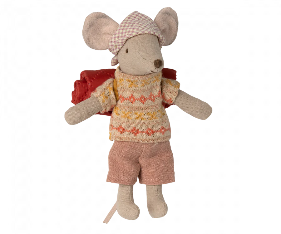 A Maileg Hiker Mouse, Big Sister from the hiker collection, wearing a patterned beanie, a sweater with a yellow and orange design, pink shorts, and carrying a red backpack. The beige-bodied mouse stands upright, ready for its next hiking trip into the wild nature.