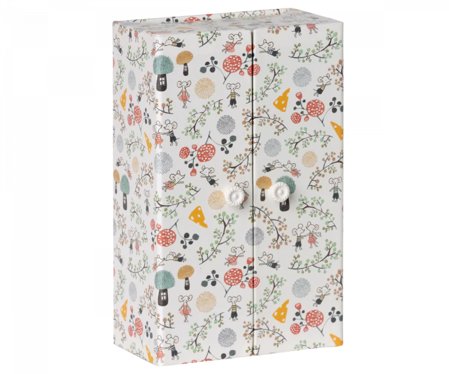 A colorful fabric-covered binder with a whimsical pattern of trees, mushrooms, birds, and Maileg Wedding Mice Couple in Box in various colors, secured with a silver button closure.