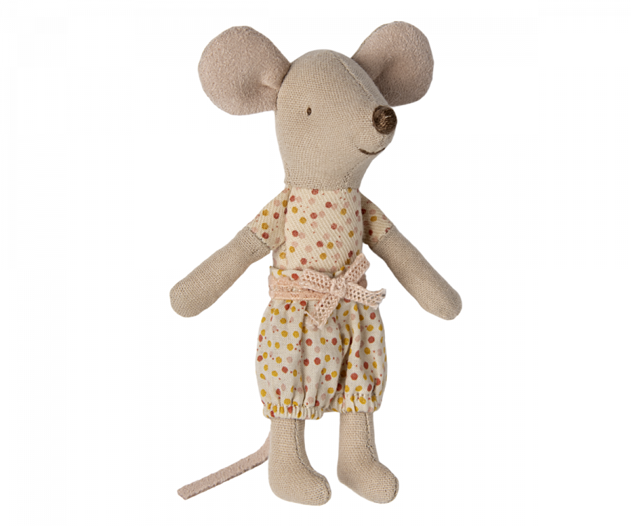 A Maileg Little Sister mouse in matchbox in a yellow polka-dot dress and a beige belt, standing upright on a black background. The mouse has large ears, a stitched nose, and a tail.