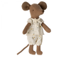 A brown Maileg Big Sister, Mouse In Matchbox with large ears, wearing a white floral-patterned top and matching pants, stands against a white background. Made from soft fabrics, the mouse has a simplistic, stitched facial expression and a long tail. This charming toy is perfect for tucking into its cozy matchbox bed.