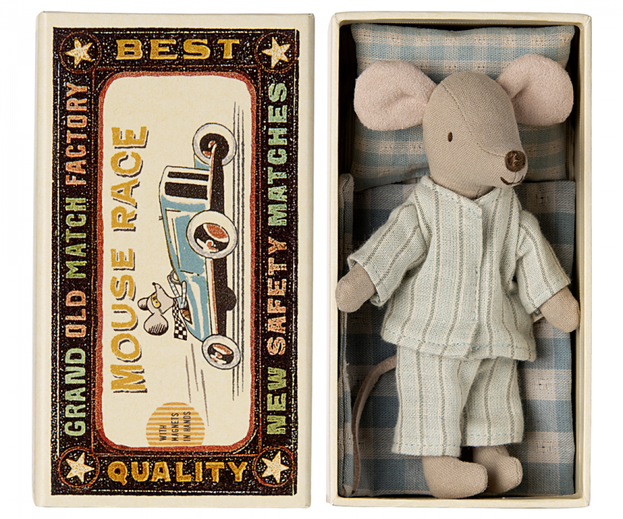 A Maileg Big Brother mouse in matchbox pajamas tucked into a similar matchbox bed converted into a cozy nook.