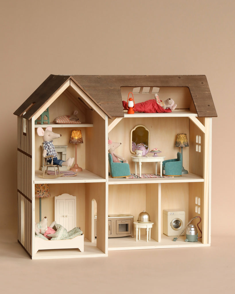 A Maileg Farmhouse - Fully Furnished dollhouse with beautifully detailed furniture and two toy mice from the Maileg collection, one in each of the upper rooms, set against a plain beige background.