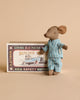 A Maileg Big Brother Mouse in Box toy in a striped blue pajama standing next to a vintage matchbox illustrated with a mouse riding a car.