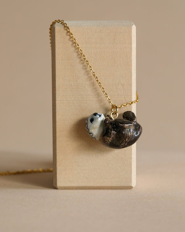 otter necklace with gold chain