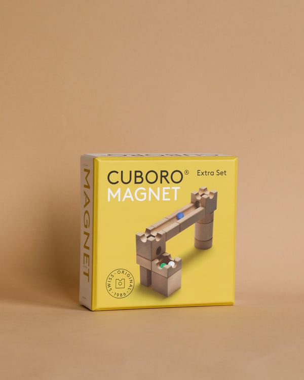 A Cuboro Magnet Marble Run Extra Set box, featuring a colorful image of wooden blocks with magnets, displayed against a light beige background.