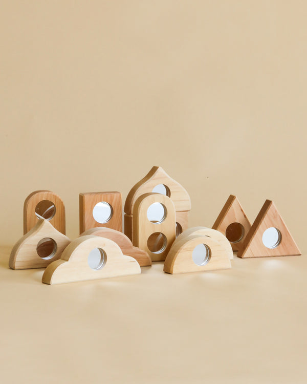Wooden shapes with inserted mirrors circles