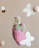 A Handmade Mobile - Field of Strawberries - Final Sale featuring a smiling mouse resting on a pink strawberry, surrounded by white flowers and felt balls, against a light backdrop.