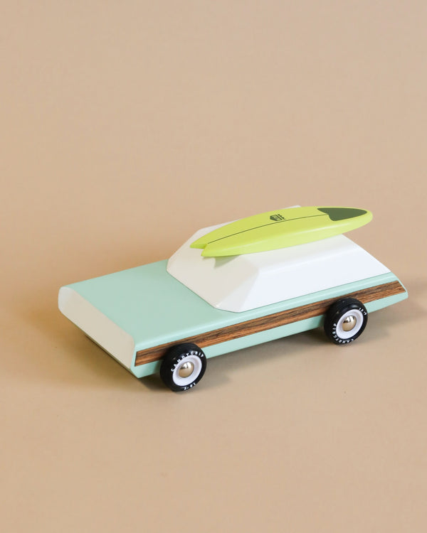 wooden car toy with surfboard