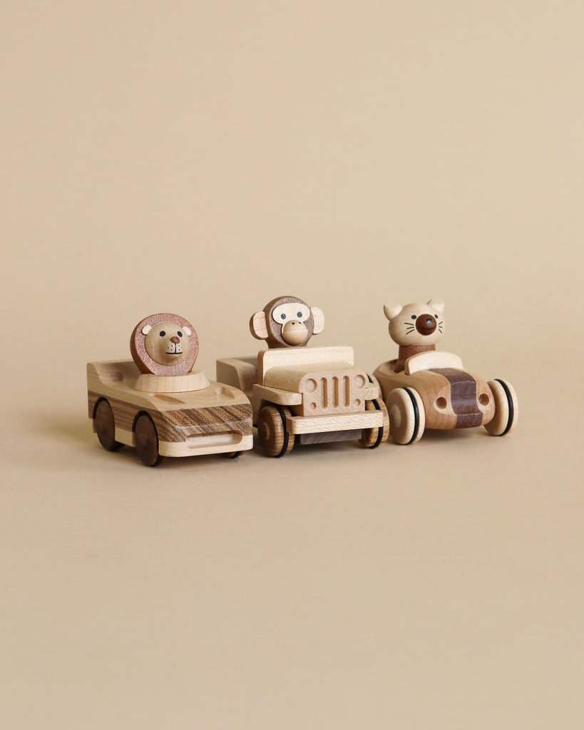 Three wooden car toys with animal inside.