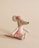 A Maileg Ballerina Mouse - Big Sister wearing a rose tutu shirt and a bow, sitting against a plain beige background.