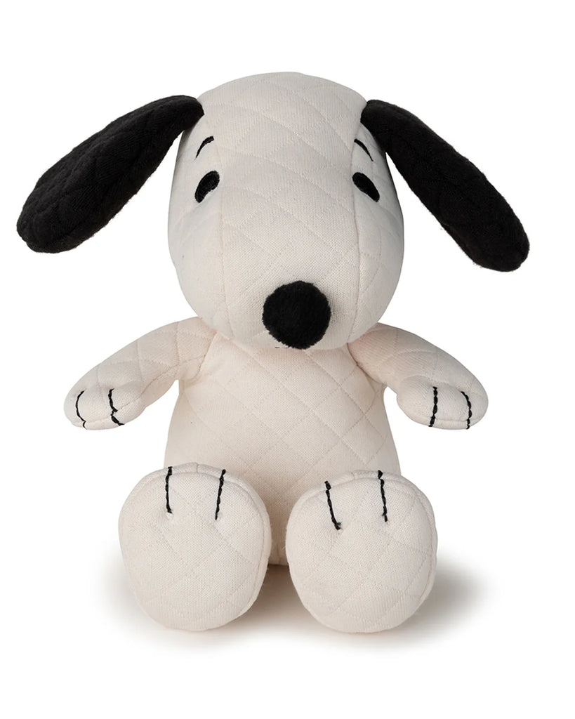 The Peanuts Snoopy Plush Toy in Gift Box features a charming white body with black ears, quilted texture, a black nose, and simple stitched facial details. Sitting upright on a plain white background, it's an iconic addition to any plush collection.