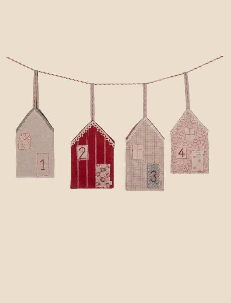 The Maileg Christmas Street, Advent Calendar features four fabric house ornaments in beige and red, each with unique embroidered patterns and numbered 1 to 4, creating charming Christmas decorations for your home.