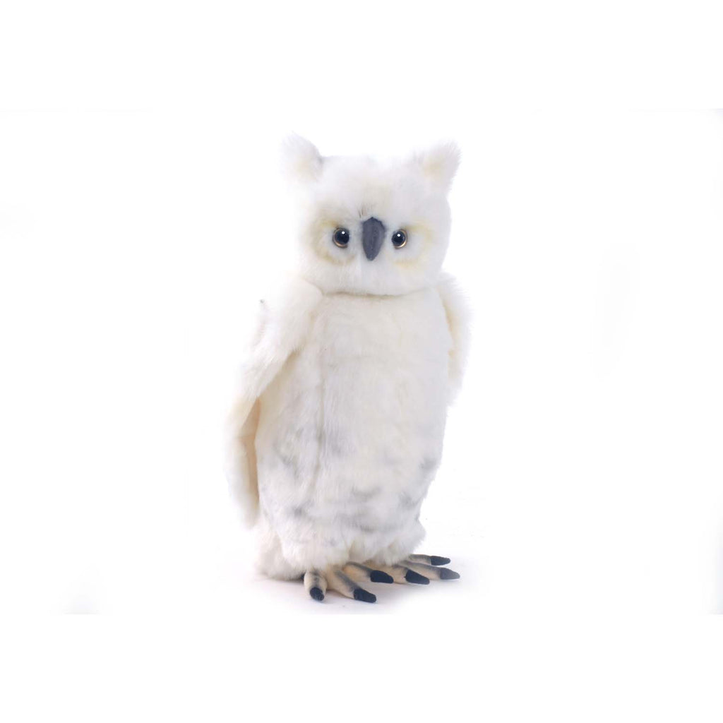 The Snowy Owl Stuffed Animal features soft white fur with grey markings, yellow and black eyes, and detailed brown and black feet. This hand-sewn plush toy from HANSA animals stands upright against a plain white background.