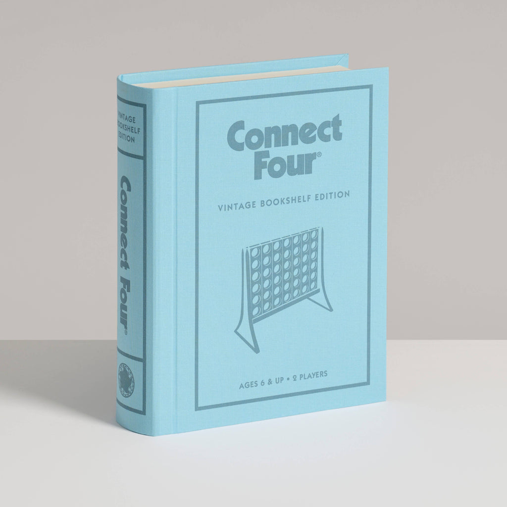 A light blue "Board Game: Connect 4 Vintage Bookshelf Edition" stands upright on a white surface, its cover and spine featuring matching title and game grid design—ideal for any collectible edition shelf.
