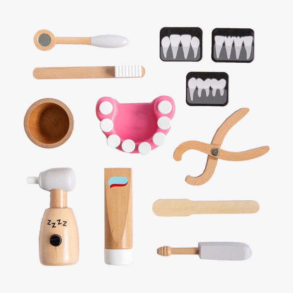 The Wooden Dentist Set is a wooden toy kit featuring dental tools such as a toothbrush, toothpaste, mirror, pliers, drill, model teeth, X-rays, cup, and tongue depressor—neatly arranged on a white background.