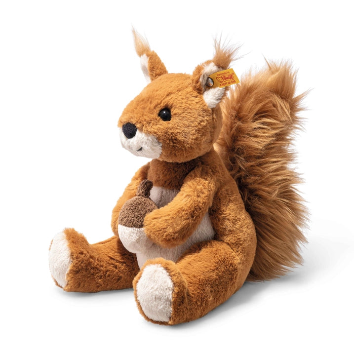 A plush toy Phil Squirrel Stuffed Plush Animal by Steiff with soft brown fur, white accents, and a bushy tail, sitting on a white background. The toy features realistic eyes and a detailed face, marked with a button.