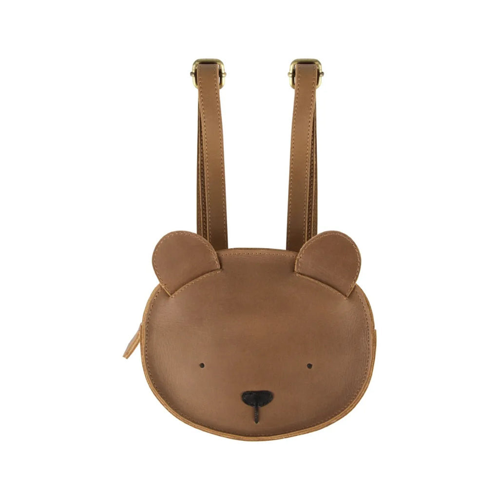 A Donsje Mini Leather Backpack - Bear designed to look like a bear's face, with small round ears on top and a black nose at the center, against a white background.
