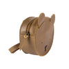 A small, round, brown leather Donsje Mini Leather Backpack - Bear designed to look like a bear's face in the Donsje design, featuring small ears, black nose, and eyes, with a zip closure.