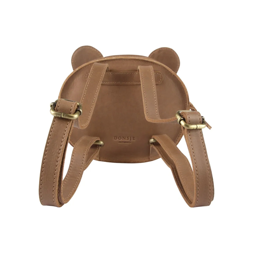 Brown leather backpack designed to resemble a bear, featuring two small rounded ears on top and adjustable straps, with the brand "Donsje" embossed on the back. This Donsje Mini Leather Backpack - Bear is part