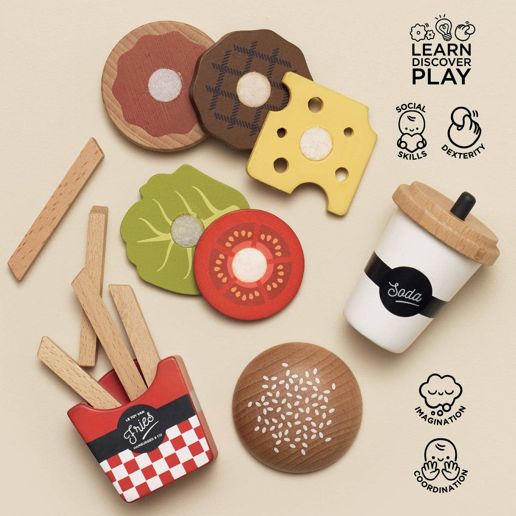 The Gourmet Hamburger Set, made from sustainable wood, includes burger bun pieces, cheese, tomato, lettuce, fries in a red box, and a drink cup. Fun illustrations highlight social and coordination skills. Ships in one week.