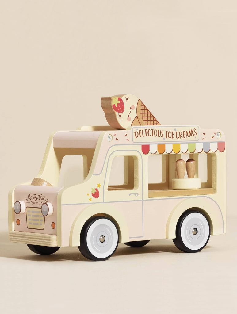 The Wooden Ice Cream Van, in pastel yellow and white with a large cone on top and mini ice creams visible through the window, makes perfect wooden doll accessories. Its sign reads "Delicious Ice Creams." Ships in one week.