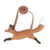 A whimsical Donsje Jimp Purse - Fox shaped like a fox in a leaping pose, featuring an adjustable leather strap, white fur detail on the tail, and stitched accents.