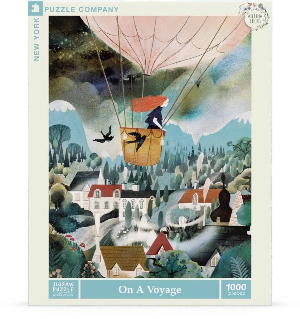 Illustration of a Adelina Lirius, On A Voyage Puzzle - 1000 Piece box featuring a whimsical scene with a hot air balloon floating above a lush landscape, including a village, waterfall, and forest. A dragon flies near the balloon.