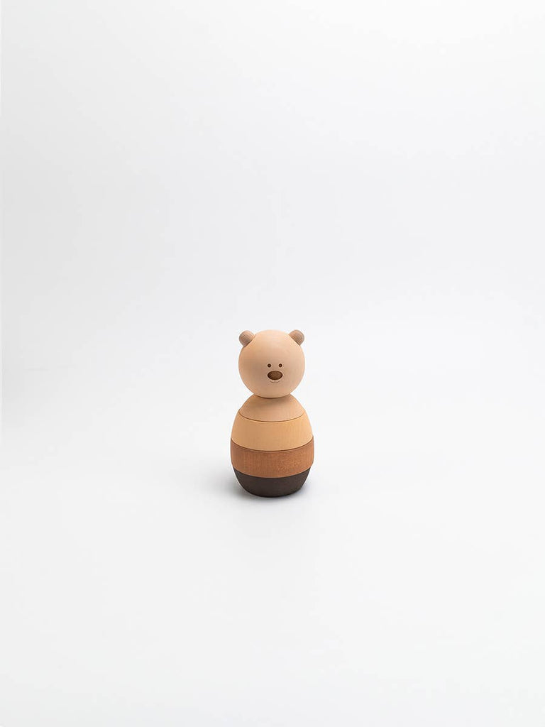 The Sabo Concept Bear Stacker - Beige features a simple wooden design with a round head and body, painted in light and dark brown stripes, perfect for stacking ring games.