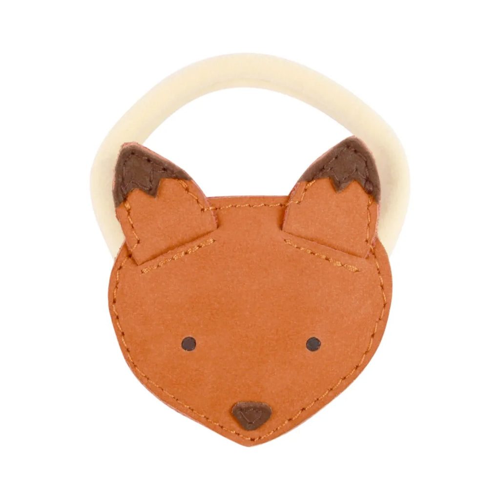 A baby's Donsje Leather Hair Tie - Fox, crafted from premium leather and cream-colored materials with stitched details for the ears, eyes, and nose.