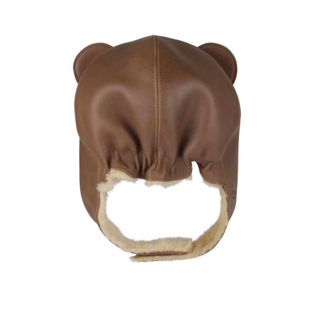 A brown Donsje Leather Classic Hat - Bear with ear flaps and sheep wool lining, viewed from the back on a white background.