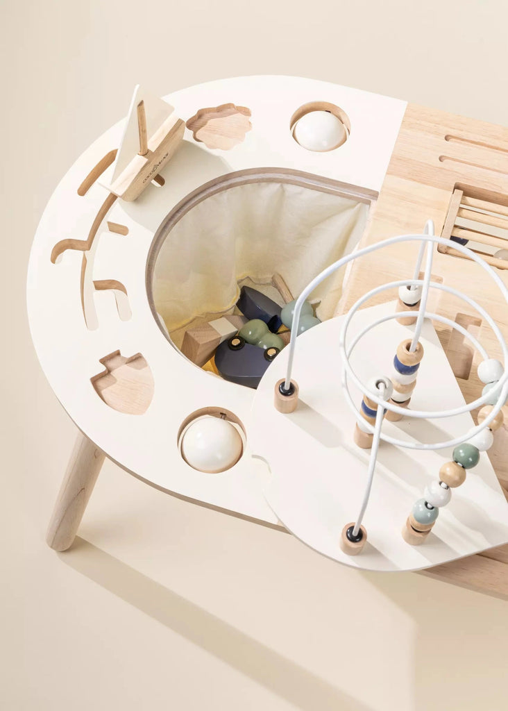 A modern Wooden Activity Table for children featuring various educational toys and games, including shape sorters, beads on wires, and movable parts.