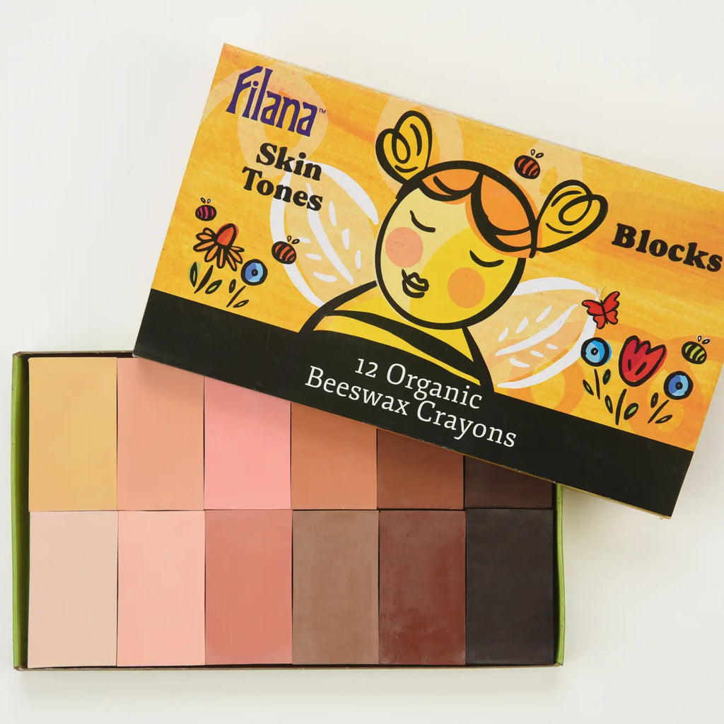 A box of Organic Beeswax Crayons: 12 SkinTones in Blocks, featuring 12 organic beeswax crayons in various shades of skin tones, arranged in two rows. The box, made from recycled paper, has