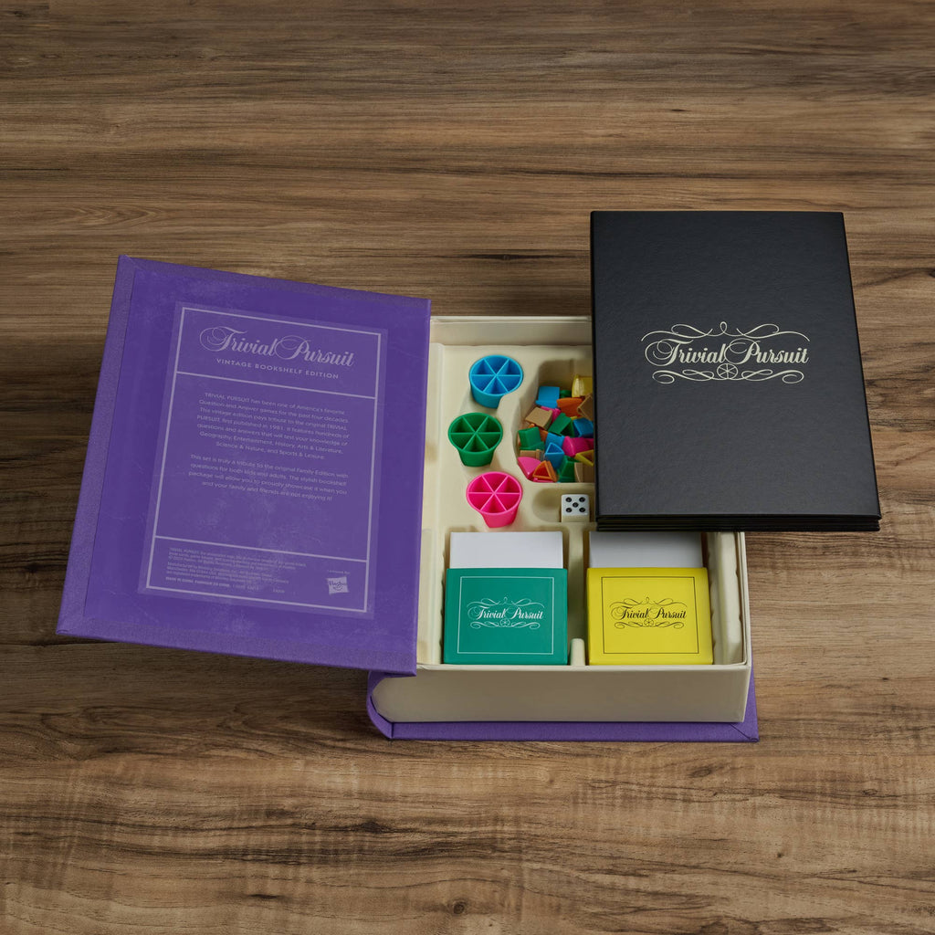 The Board Game: Trivial Pursuit Vintage Bookshelf Edition features colorful question cards, game pieces, a die, and a rulebook in a stylish purple and black box—ideal for classic trivia fans.