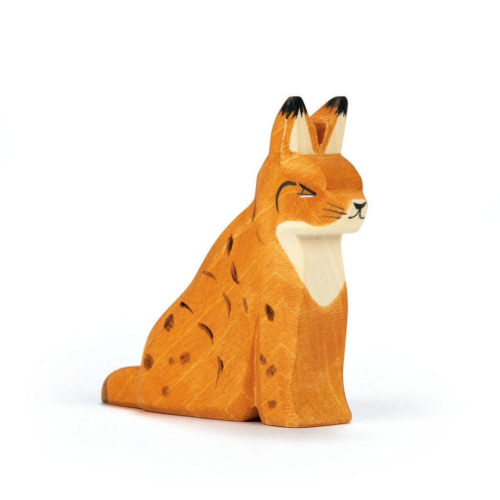 The Ostheimer Lynx Sitting is a handcrafted wooden figurine, painted orange with dark spots and black-tipped ears. Inspired by classic Ostheimer designs, it’s perfect for imaginative play and makes a graceful addition to any collection.