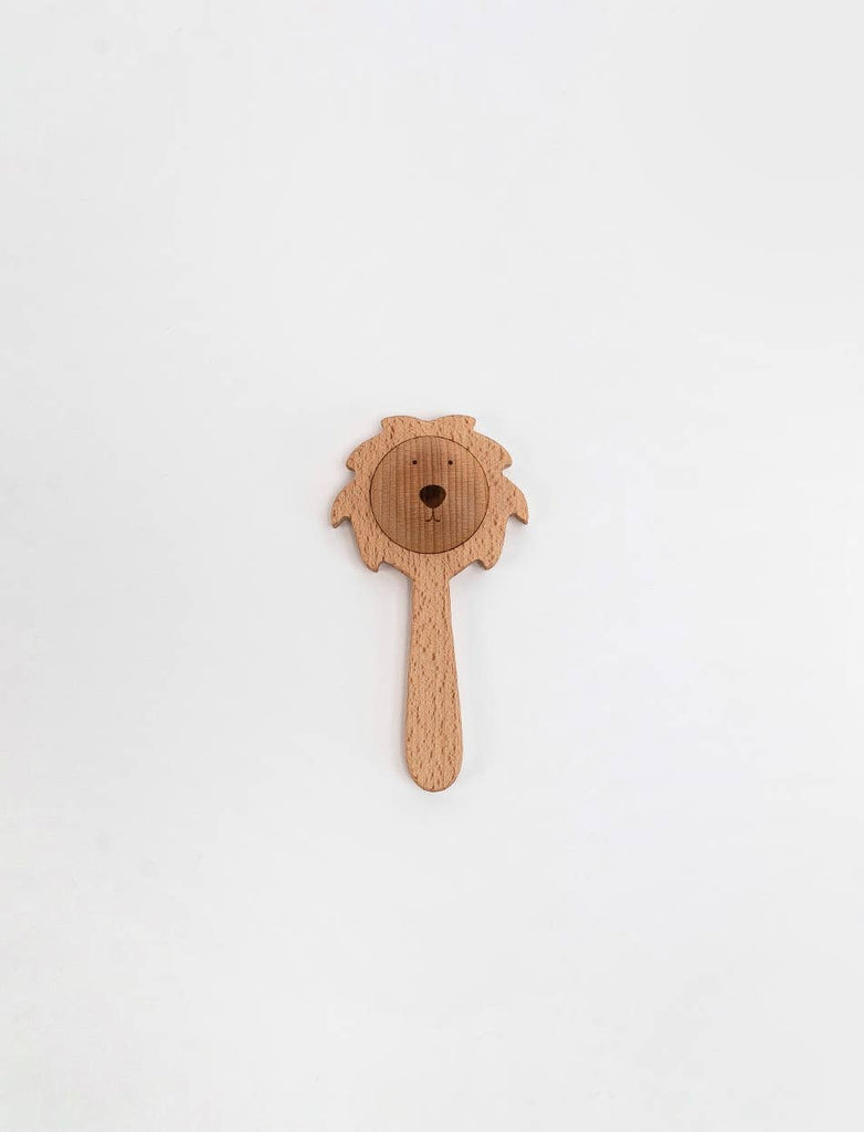 The Sabo Concept Lion Rattle - Natural is a delightful baby toy with a wooden lion face and round handle, made from natural materials and shown on a plain white background.