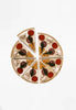 A Sabo Concept Wooden Pizza puzzle toy with pieces featuring toppings like mushrooms, tomatoes, and basil leaves, arranged on a white background and coated with non-toxic paint.